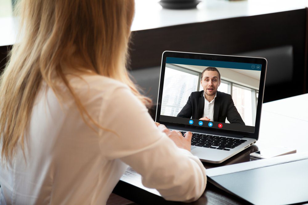 employees using remote working technology to ost virtual conference meetings